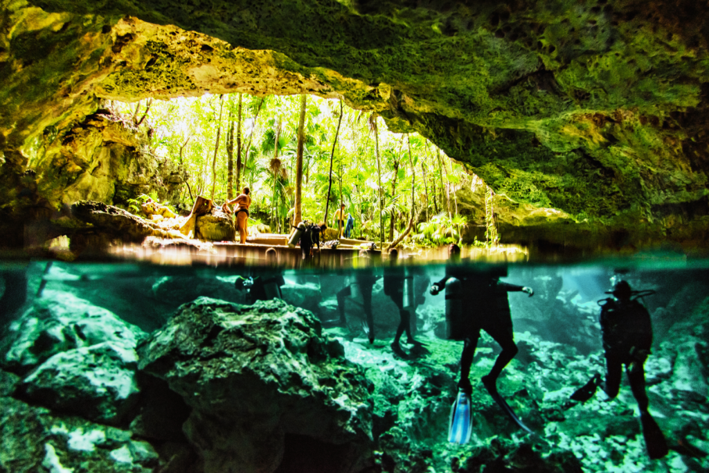 A diver snorkeling in Cenote Dos Ojos, Tulum, Mexico.