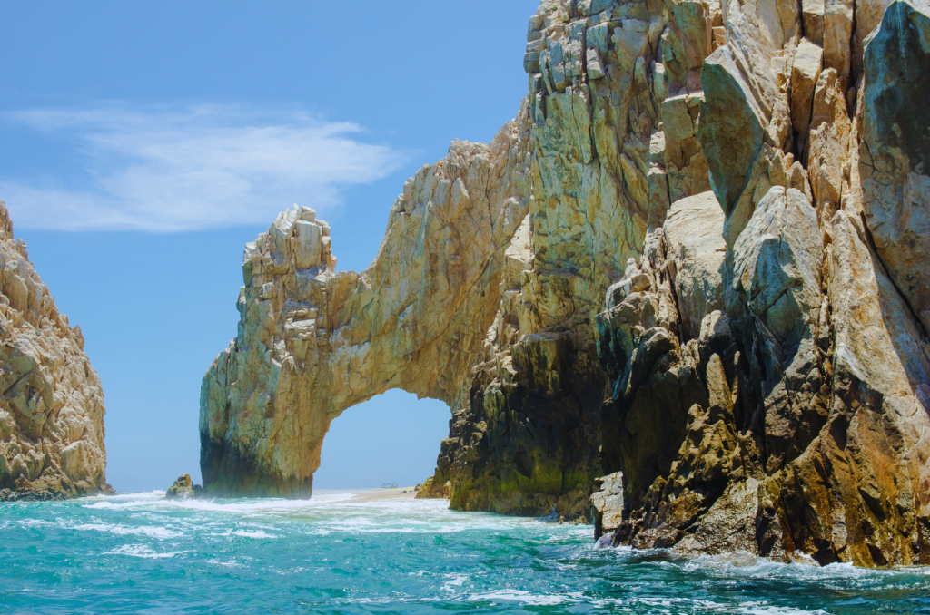 An arch-shaped rock in the sea in the bay of Cabo San Lucas.