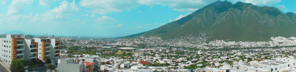 A panoramic view of Monterrey, Nuevo León, with the majestic mountains providing a stunning backdrop to the city's modern skyline.