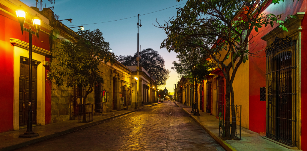 Streets in Oaxaca at dusk, dimly lit.