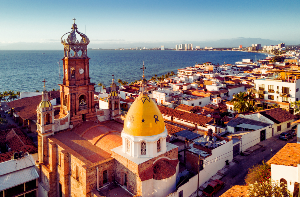 Aerial view of Puerto Vallarta, Mexico with the sea in the horizon and a church on the main view.