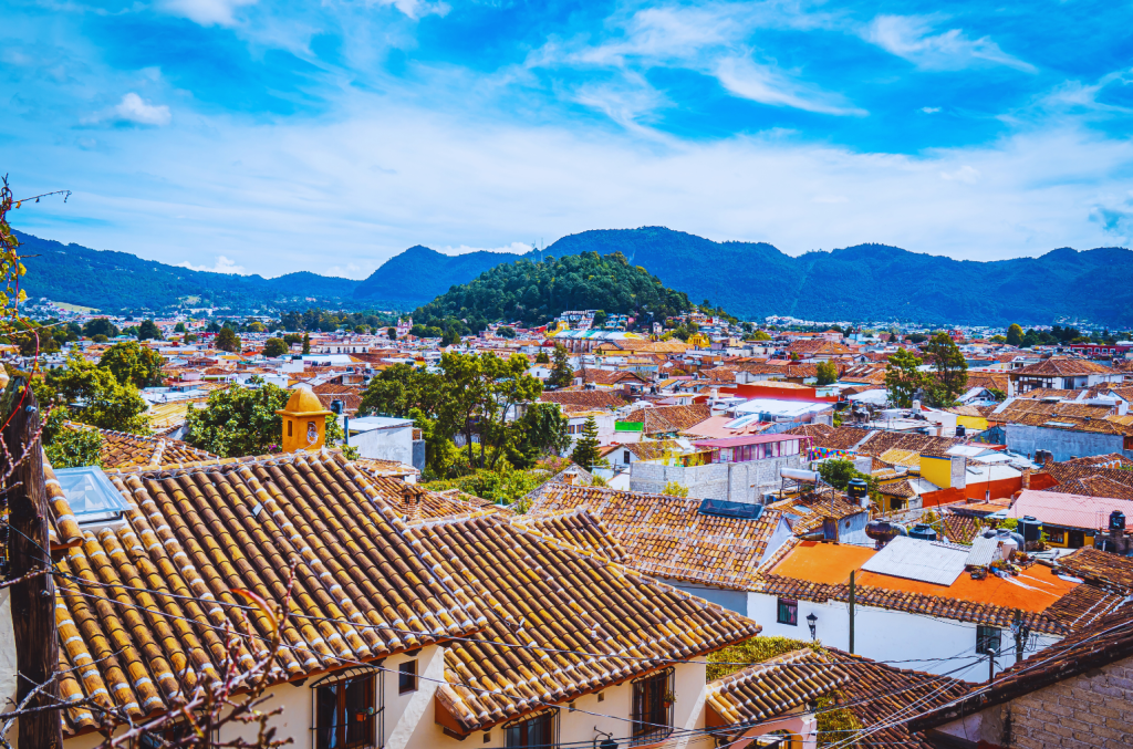 Aerial view of San Cristobal de las Casas in Chiapas, Mexico, with its colonial architecture and mountainous backdrop.